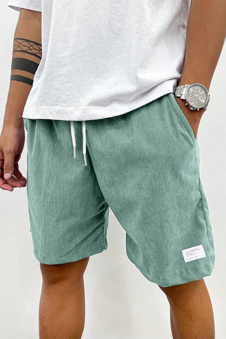 Interior view of the elasticated drawstring waistband of men's relaxed fit shorts for superior comfort.