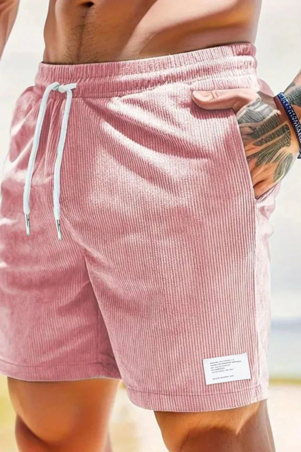 Men's relaxed fit drawstring shorts styled casually for a complete summer look, offering everyday comfort.