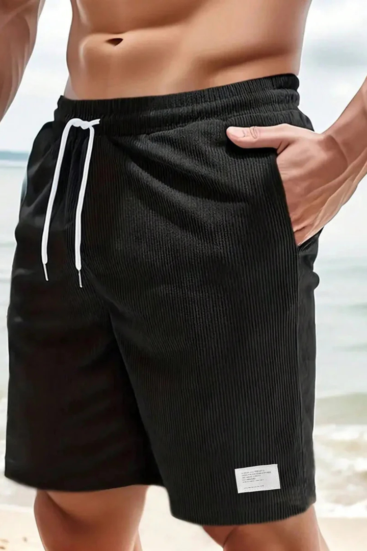 Model wearing men's relaxed fit drawstring shorts, ideal for casual summer style and everyday comfort.