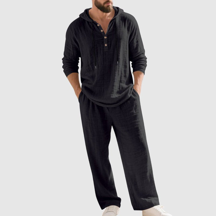 Stylish men's hooded top with drawstring pants. Relaxed-fit two-piece set for summer outfits.