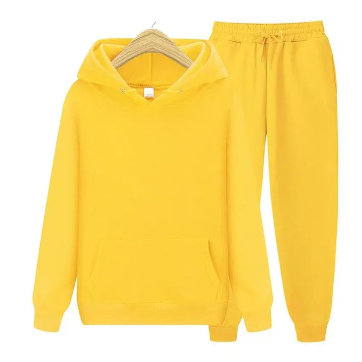 Men's sleek tracksuit set: relaxed fit hoodie & modern jogger for a fashionable edge.