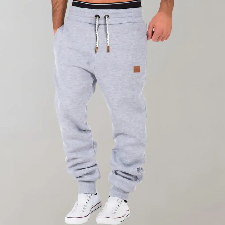 Stylish men's relaxed fit jogger pants, ideal for loungewear or active lifestyles. Comfortable casual bottoms.
