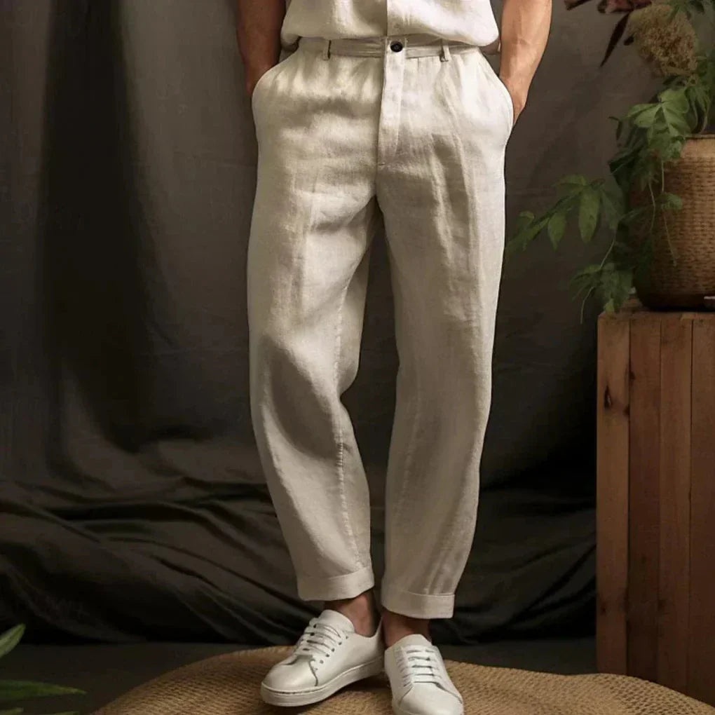 Men's relaxed fit linen casual trousers in a neutral color, perfect for airy summer style and beachwear comfort.
