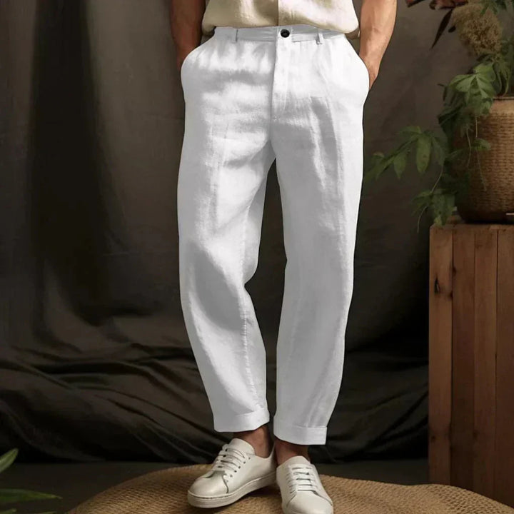 Breathable men's linen pants for summer days, offering a relaxed fit and casual comfort; ideal for beach and travel.