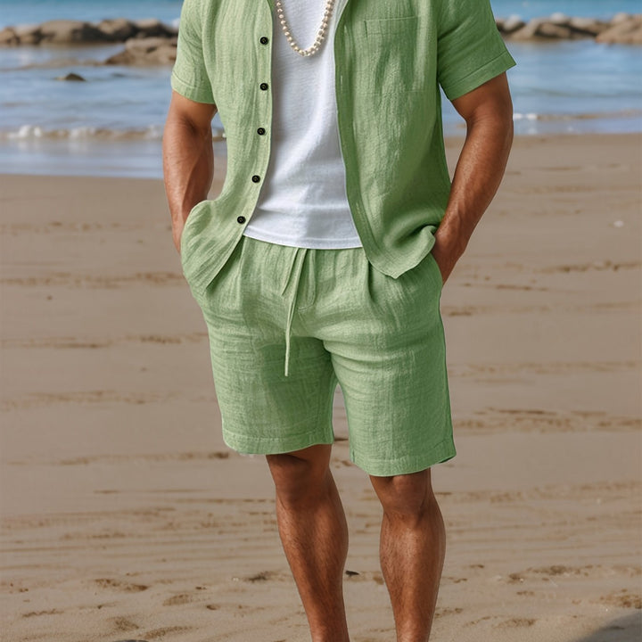 Casual men's summer outfit: comfortable linen short sleeve shirt & matching shorts for beach & vacation.