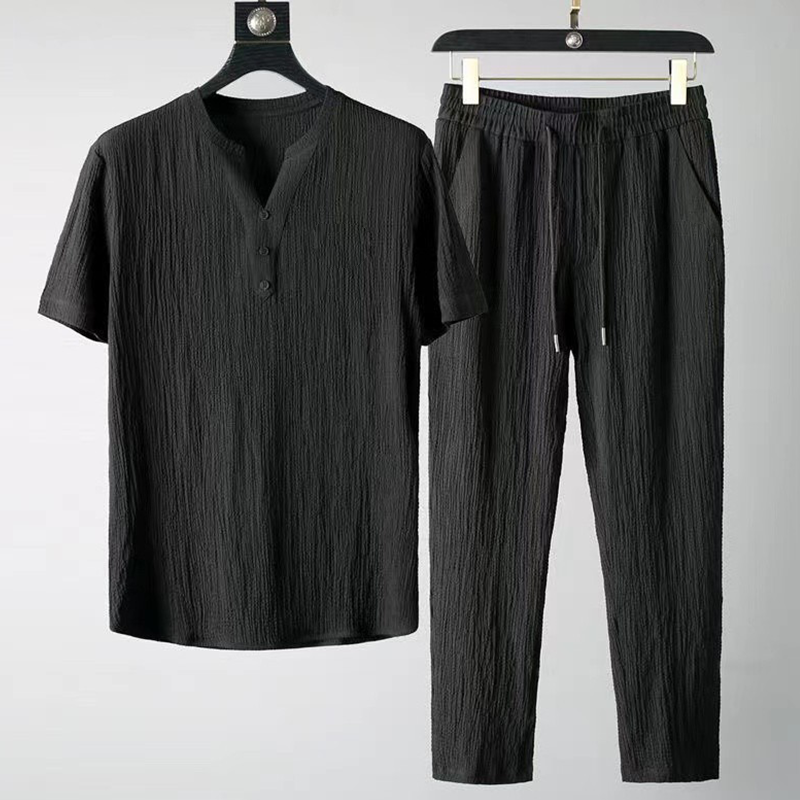 Comfortable men's casual linen V-neck two-piece set. Relaxed fit fabric for a stylish summer outfit.