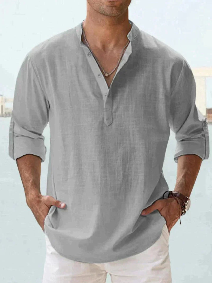 Men's relaxed fit long sleeve button-down resort shirt, a go-to for casual summer adventures.