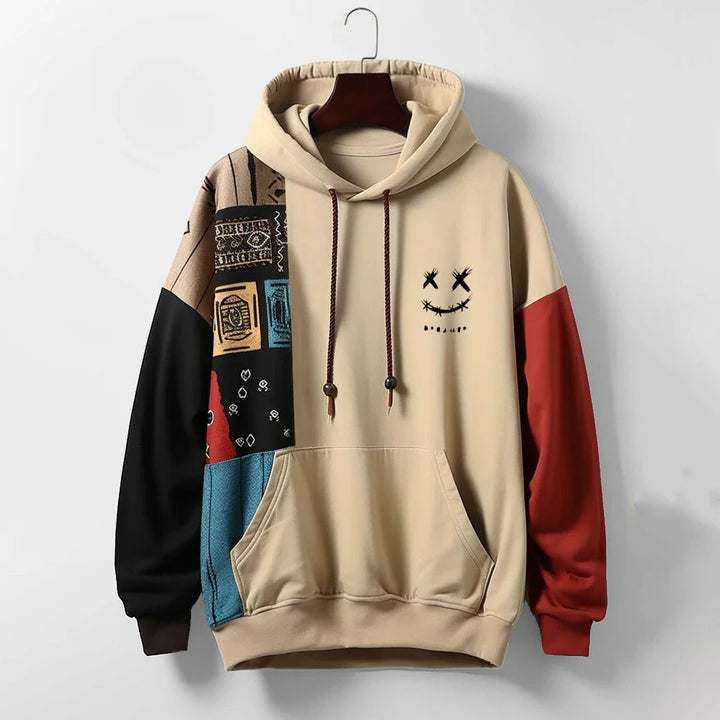 Men's relaxed fit patchwork hoodie in a bold, multi-color block design. Premium cotton blend for stylish streetwear.
