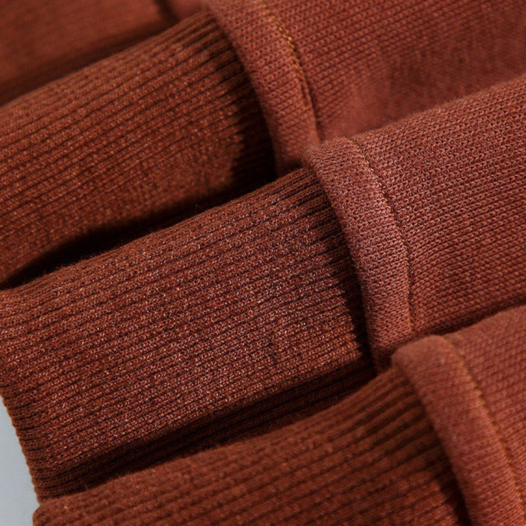 Striped long-sleeve men's relaxed fit polo sweatshirt, buttoned placket, comfort apparel.