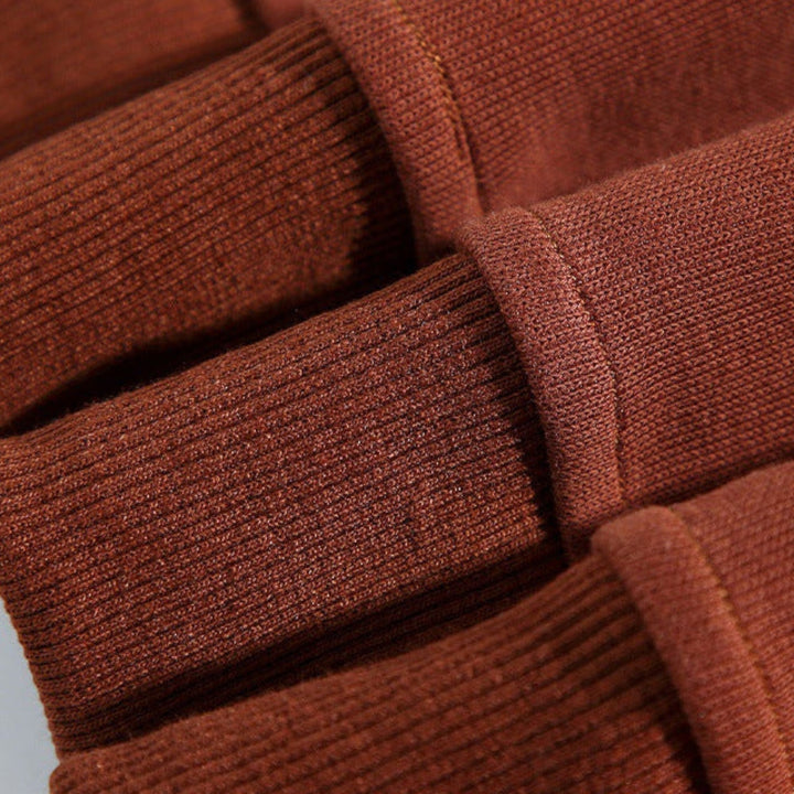 Striped long-sleeve men's relaxed fit polo sweatshirt, buttoned placket, comfort apparel.