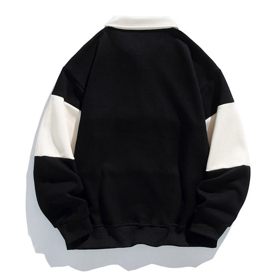 Man wearing a relaxed fit polo sweatshirt with button placket, comfortable & stylish.