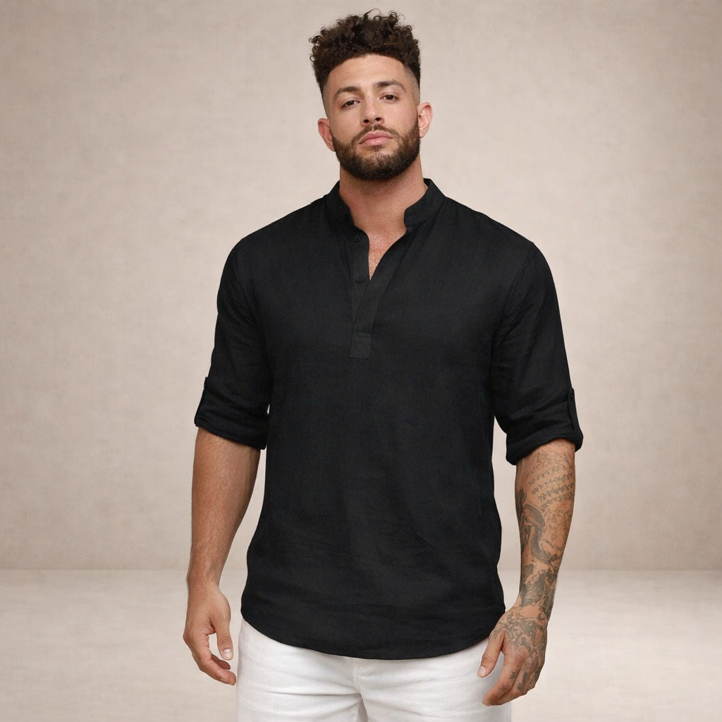 Man wearing a relaxed fit open placket roll sleeve shirt, suitable for beach or travel.