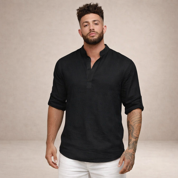 Man wearing a relaxed fit open placket roll sleeve shirt, suitable for beach or travel.