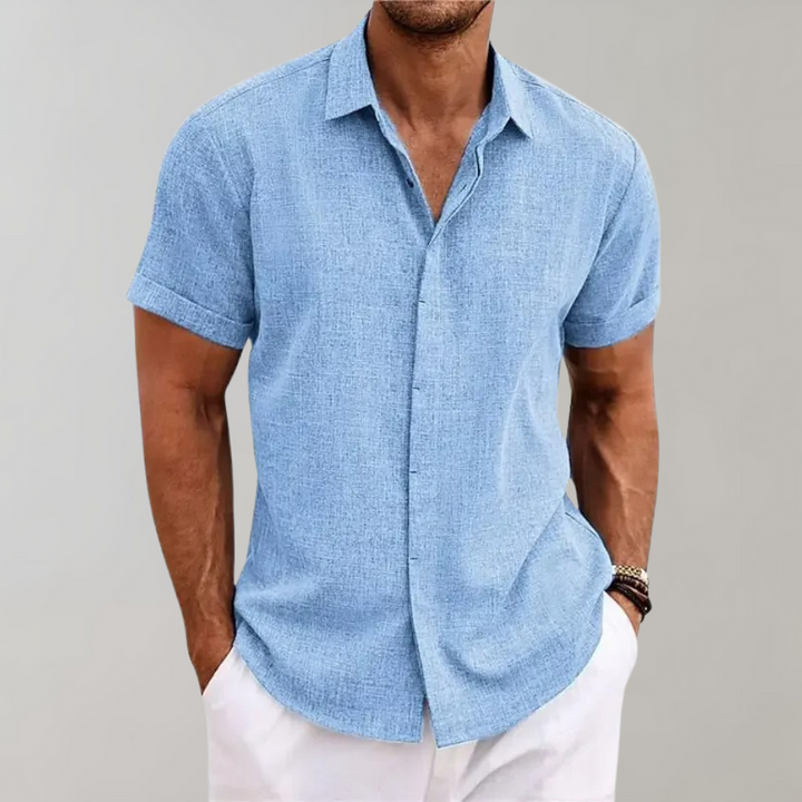 Lightweight men's relaxed fit short sleeve button-up casual shirt. Perfect summer top for men.