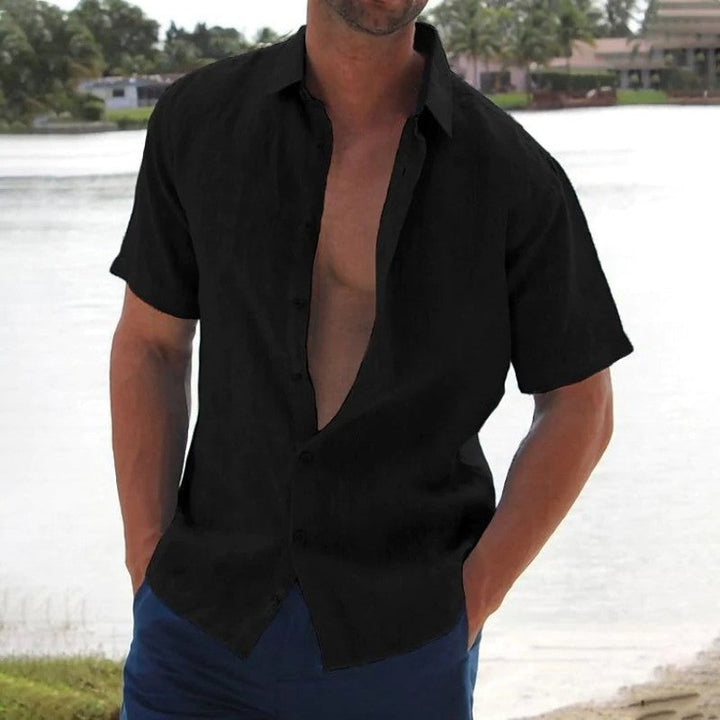 Casual men's short sleeve button-up shirt. Relaxed fit, perfect for beachwear, travel, and everyday summer fashion.