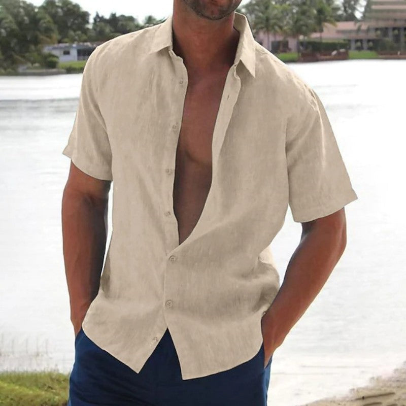 Man wearing a casual short sleeve button-up summer shirt, relaxed fit. Perfect for beach days or warm weather travel.