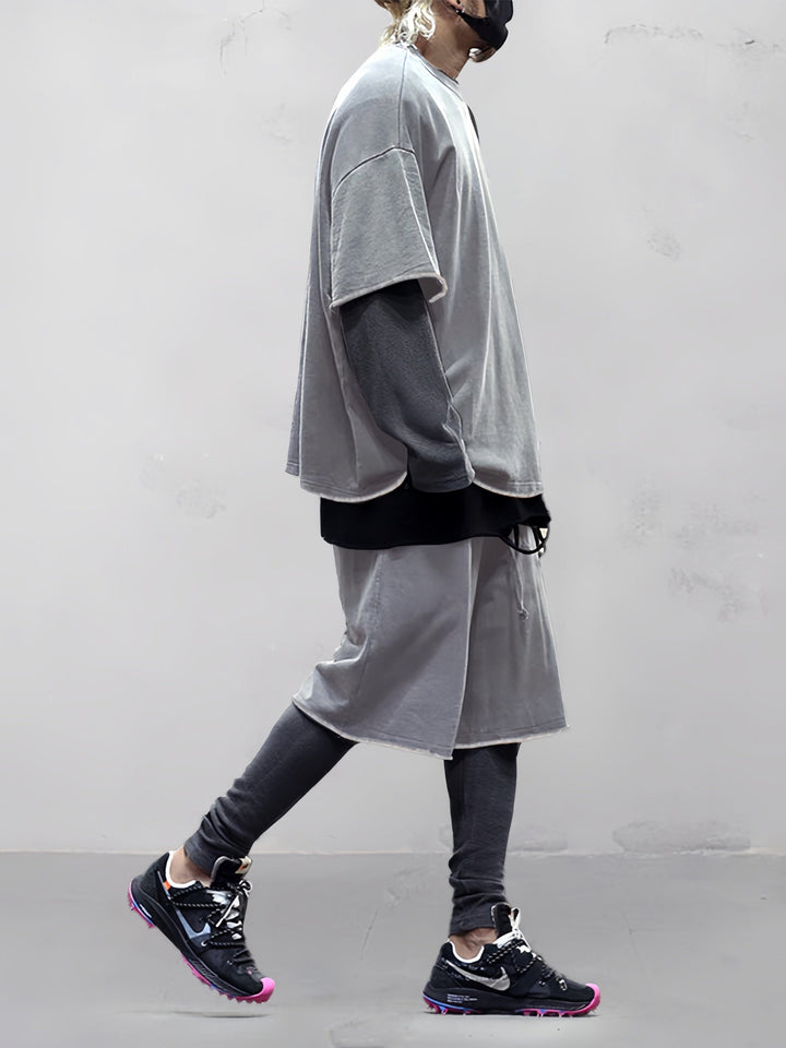 Man walking in a relaxed fit solid activewear set, ideal for casual movement & comfort.
