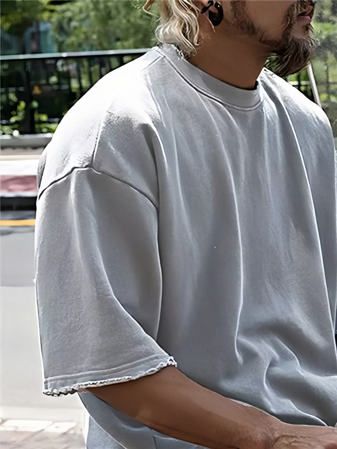 Flat lay of a solid color men's relaxed fit two-piece sports set, showcasing the design.
