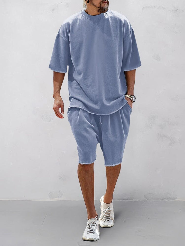 Man wearing a solid relaxed fit sports set, showcasing ultimate comfort & laid-back style.