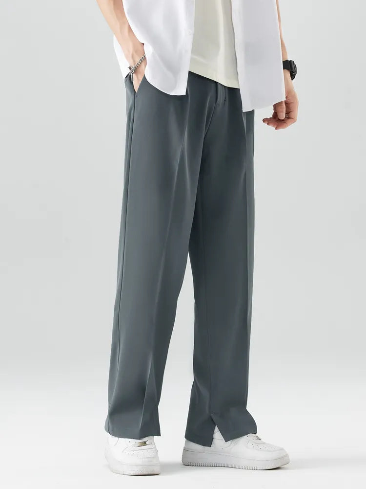 Model in men's relaxed fit straight leg trousers, showcasing comfortable, smart casual style. Soft & breathable.