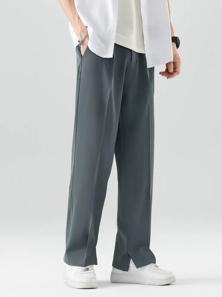 Model in men's relaxed fit straight leg trousers, showcasing comfortable, smart casual style. Soft & breathable.