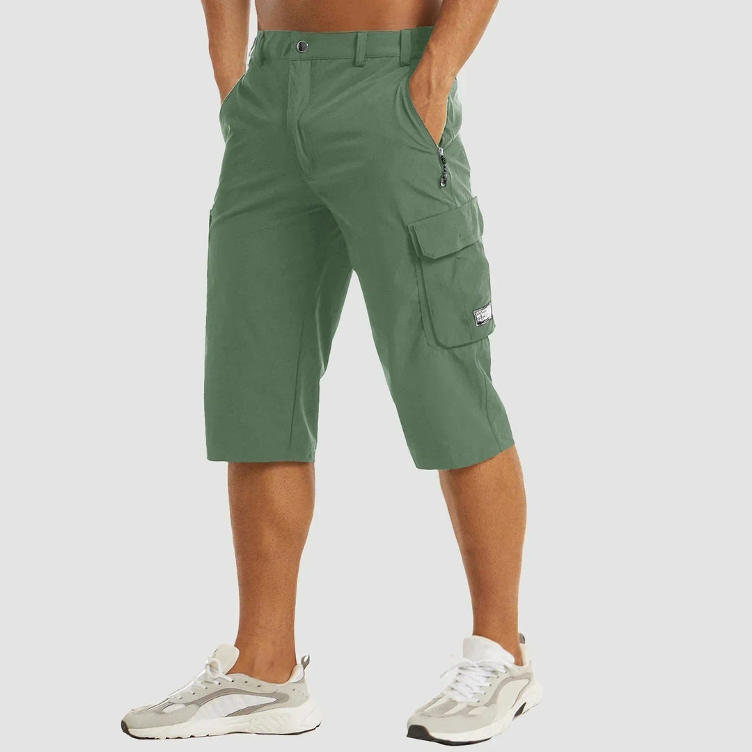 Men's relaxed fit cargo bermuda shorts with stretch fabric. Practical utility shorts for summer and outdoor activities.