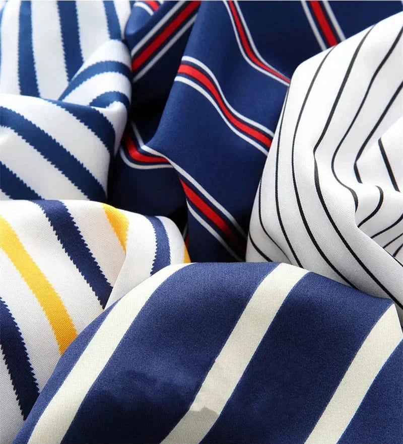 Men's fashion model wearing a relaxed fit striped button-down long sleeve shirt for a smart casual look.