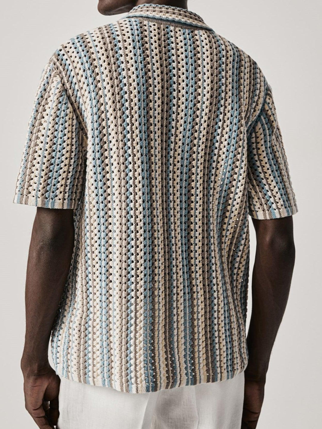 Stylish men's striped polo, relaxed fit for comfort. A modern classic short-sleeve summer shirt for casual wear.