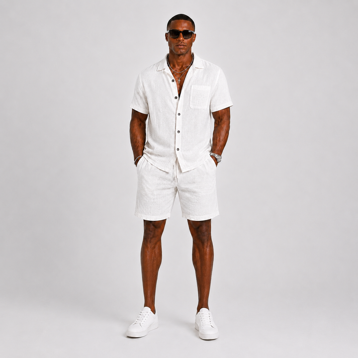 Stylish men's summer two-piece set featuring a short-sleeve relaxed fit shirt & matching shorts with an elastic waist.