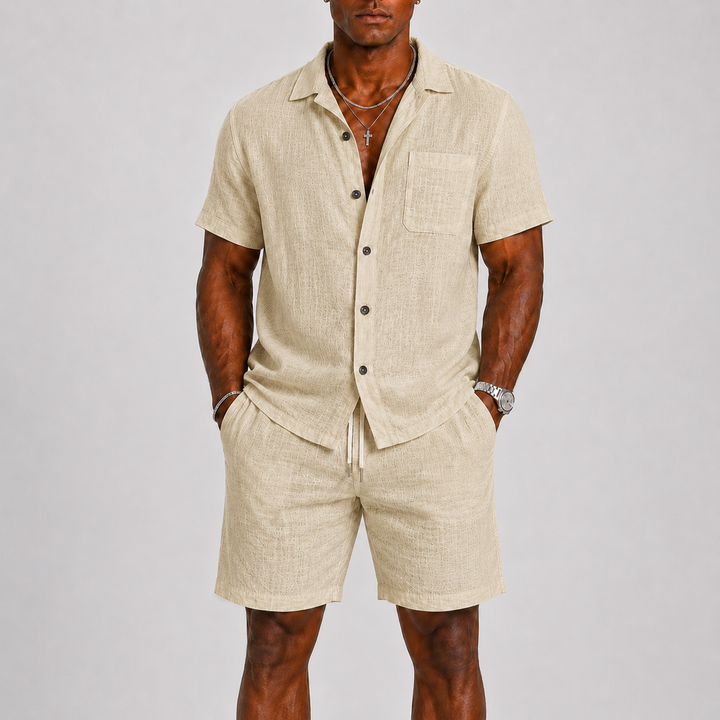 Men's casual summer outfit: a relaxed fit short sleeve shirt paired with matching shorts. Perfect for beach or everyday wear.