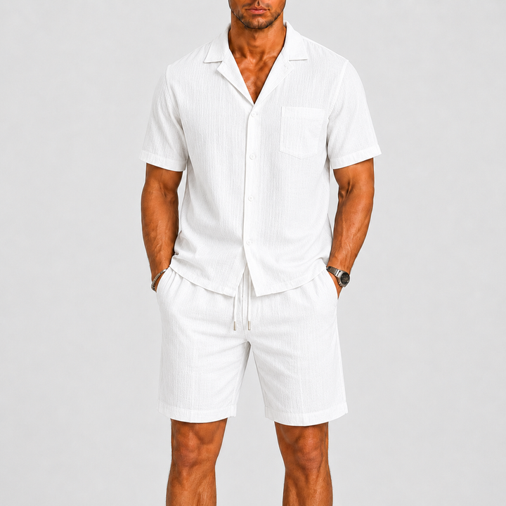 Stylish men's summer shorts set, featuring a relaxed fit shirt, great for beach style or resort wear.