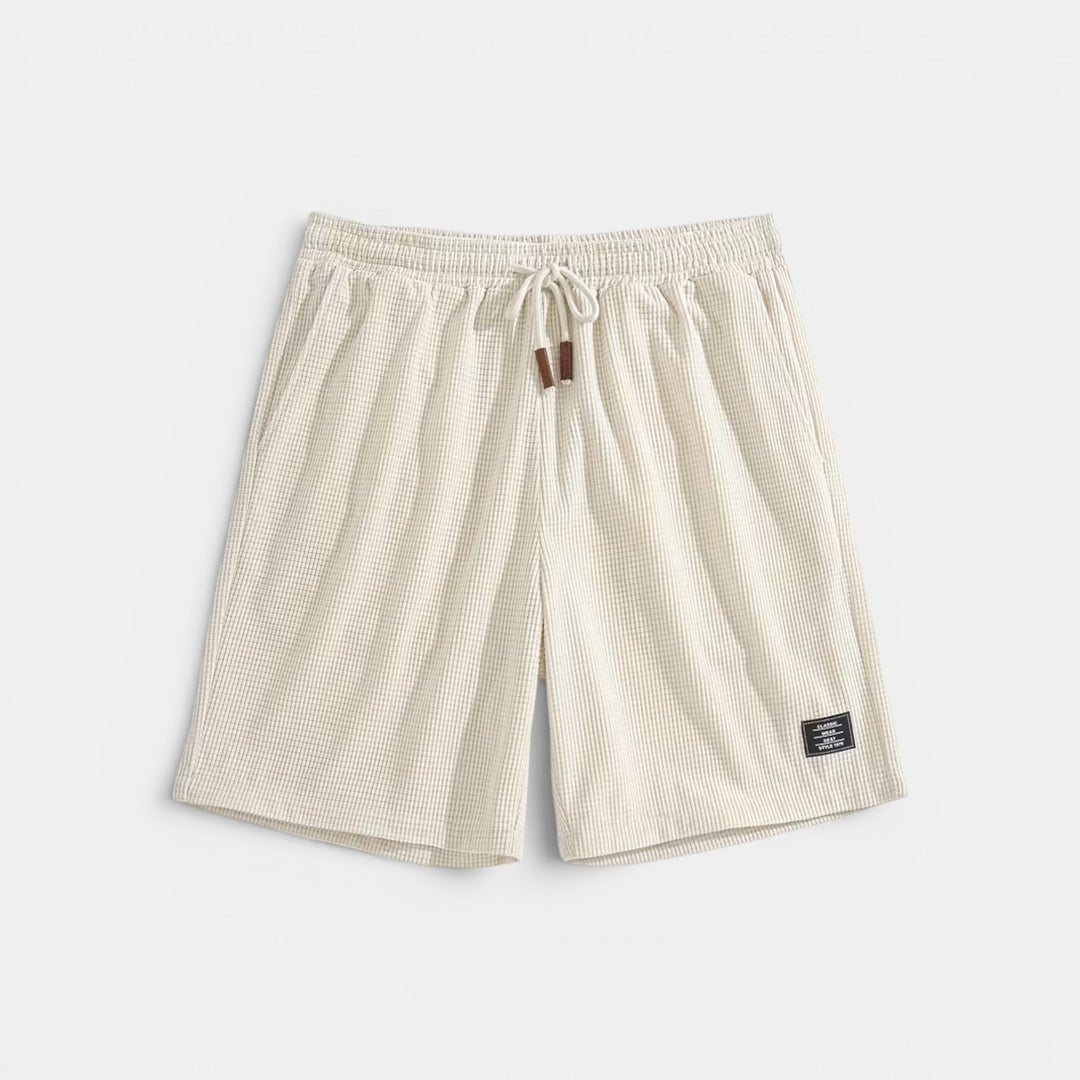Versatile men's relaxed fit summer shorts with elastic waist & pockets. Perfect for any warm weather casual activity.