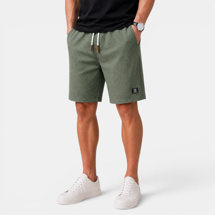 Casual men's summer shorts, relaxed fit. Elastic waist, drawstring, & pockets for beach, travel, or lounging.