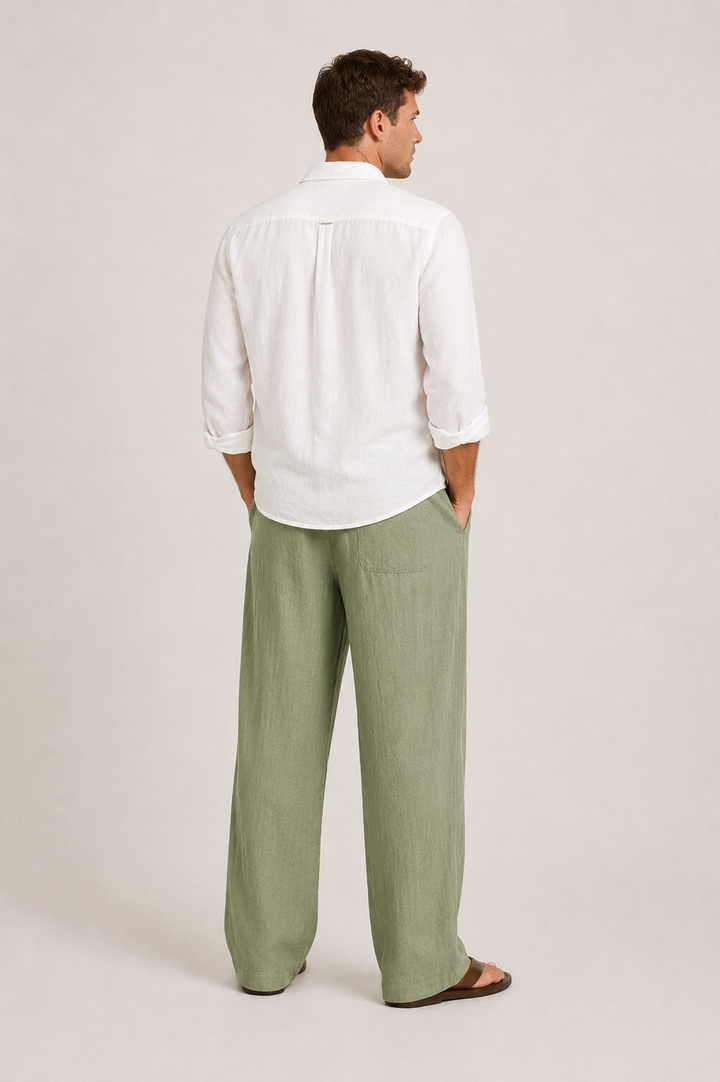 Model wearing relaxed fit men's summer pants for comfortable warm weather casual wear & travel. Versatile style.