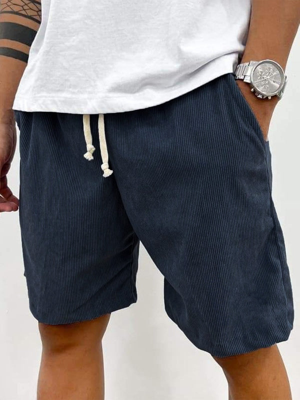 Relaxed fit men's textured drawstring shorts, offering maximum comfort for summer and casual outings.