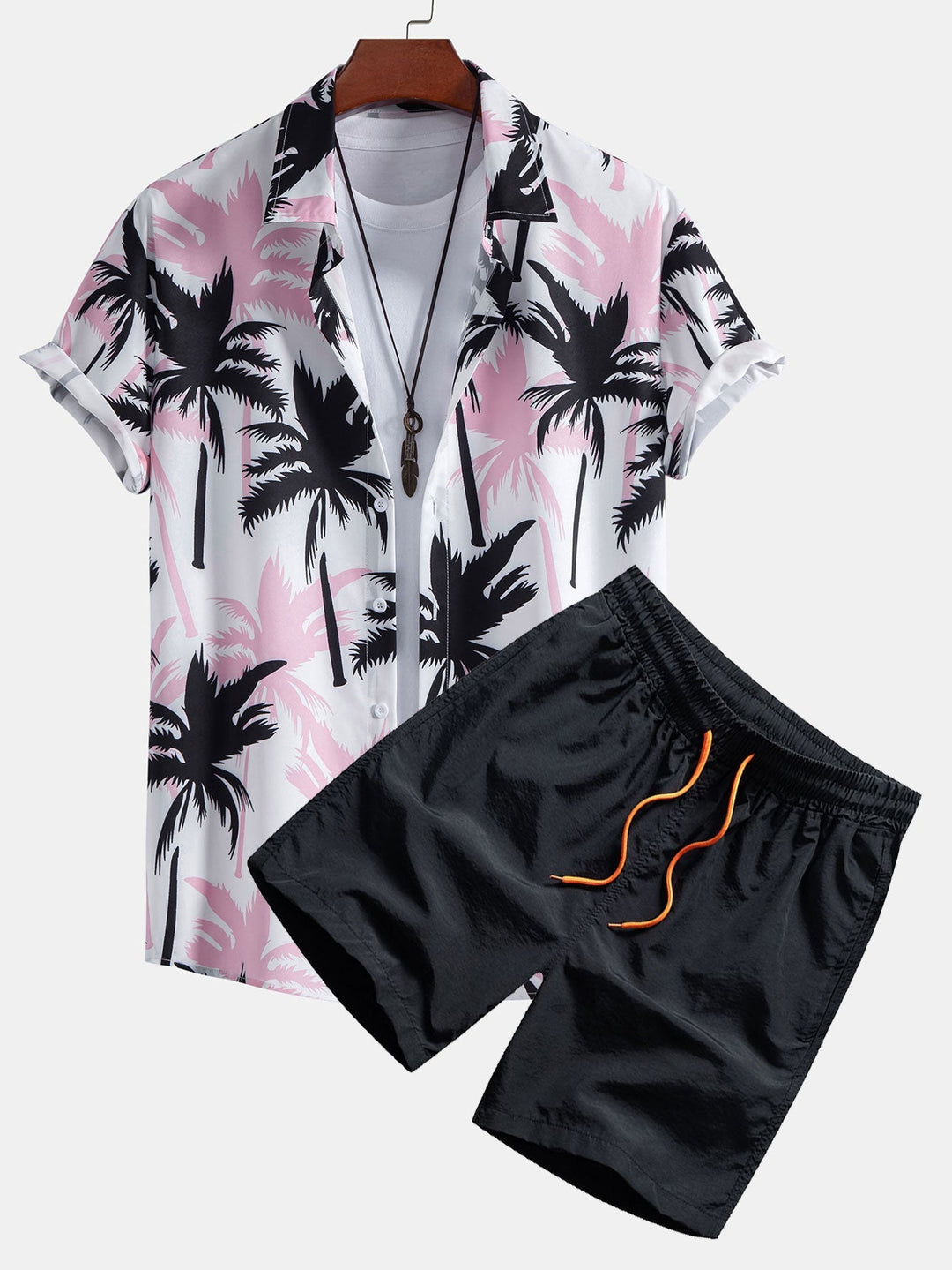 Stylish men's two-piece tropical print set. Includes a relaxed fit shirt and matching shorts for vacation.