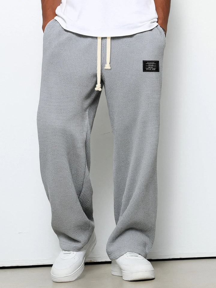 Versatile men's relaxed fit pants, great for smart casual or daily wear.
