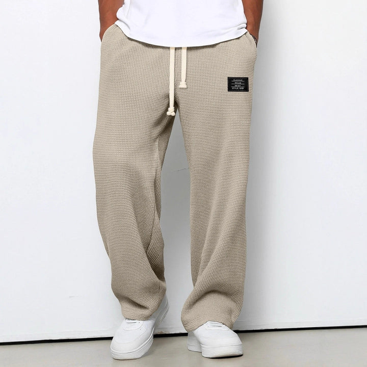 Comfortable men's casual trousers featuring an adjustable elastic waist.