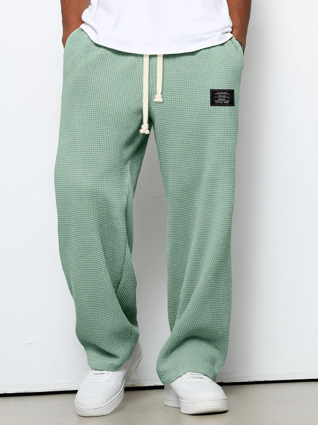 Stylish men's relaxed fit pants in breathable fabric for ultimate comfort.