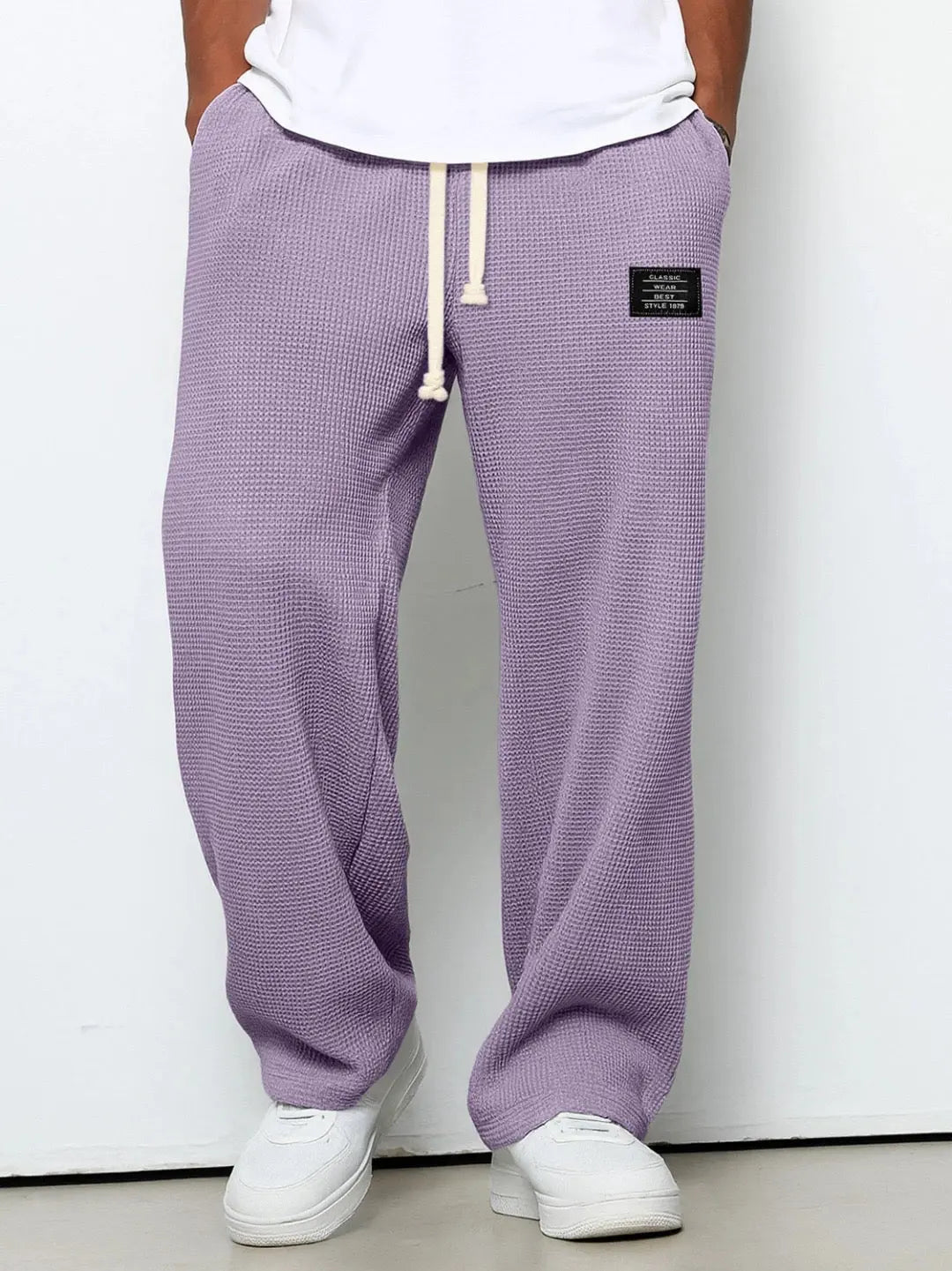 Comfortable men's trousers, relaxed fit with a practical drawstring waist for versatility.