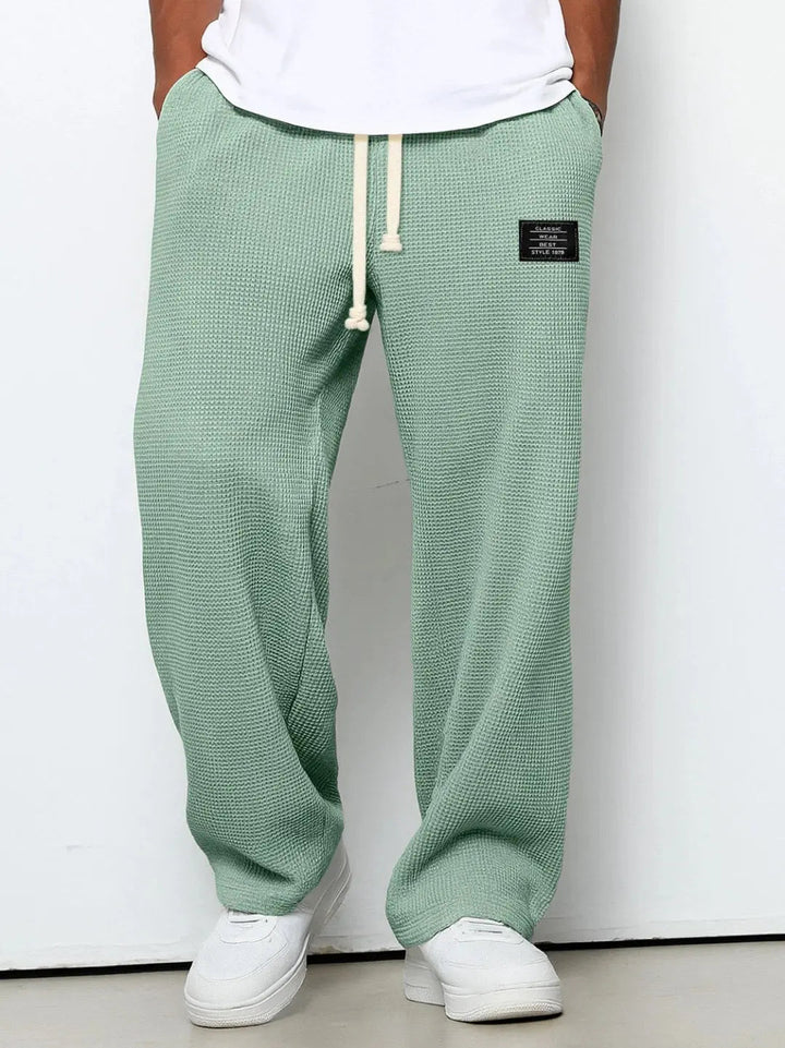 Soft fabric men's relaxed fit pants, wide leg for ultimate comfort & style.