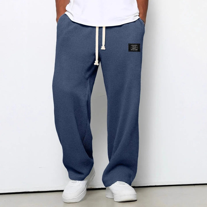 Everyday comfort men's relaxed fit trousers, perfect for casual and versatile looks.