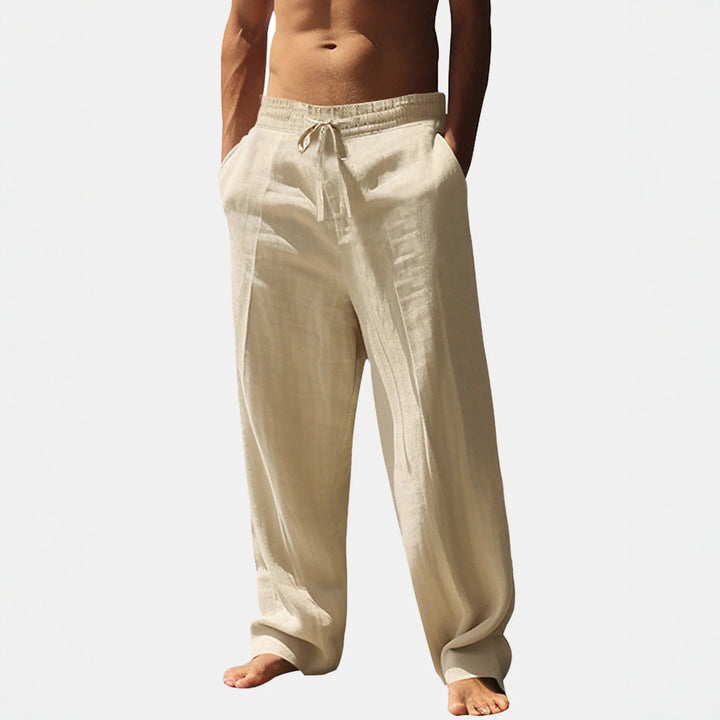 Comfortable men's relaxed fit holiday pants with elastic waist and pockets, ideal for summer travel.