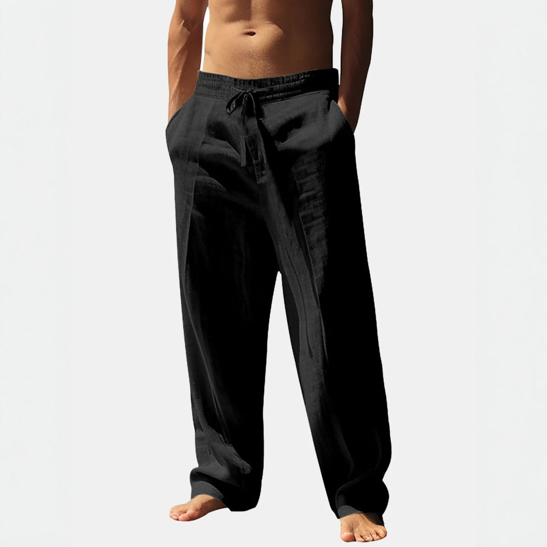 Stylish men's casual pants featuring a relaxed fit, elasticated waist, drawstring, and practical side pockets.