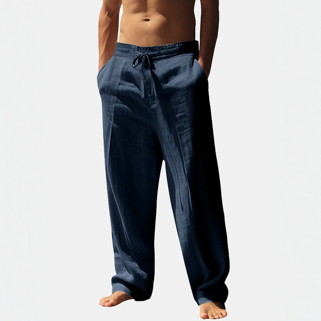 Relaxed fit men's trousers, perfect for daily wear, featuring an elastic waist, adjustable drawstring, and deep pockets.
