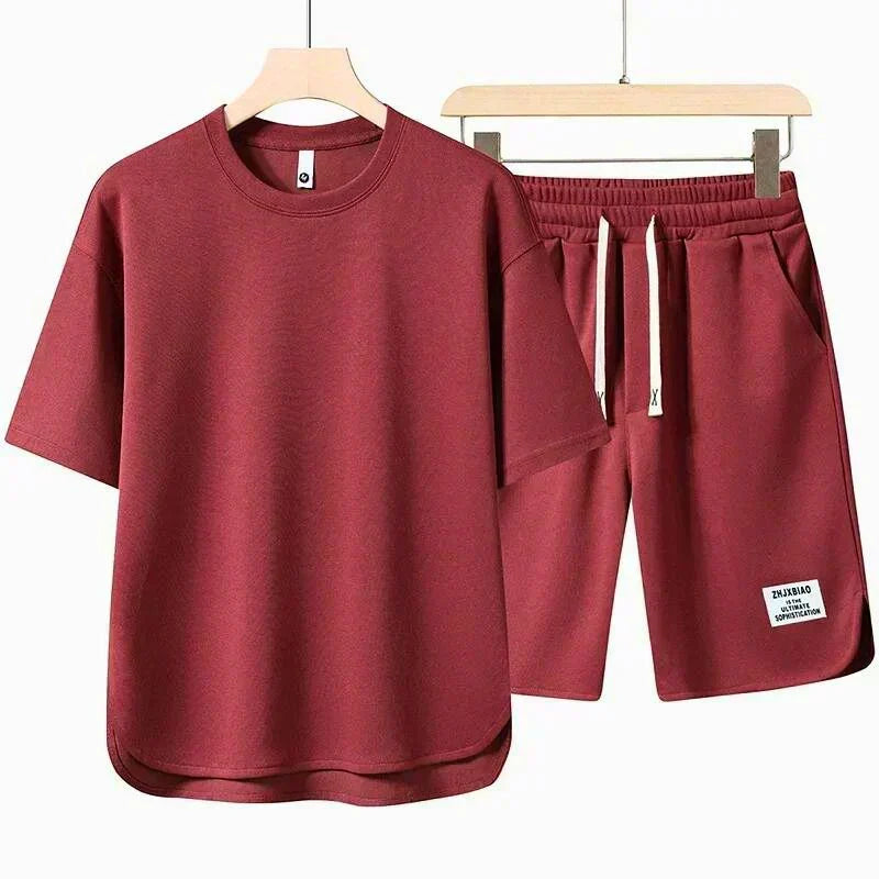 Relaxed men's t-shirt and matching drawstring shorts two-piece outfit, ideal for versatile spring and summer fashion.