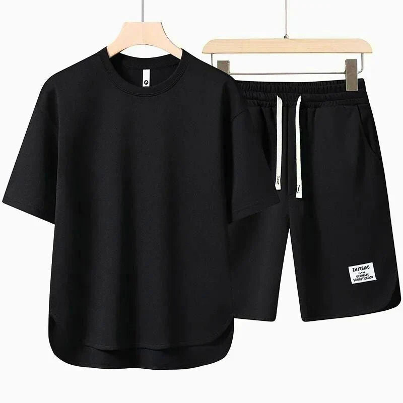 Stylish men's two-piece casual set with a relaxed t-shirt and comfortable drawstring shorts for spring & summer.
