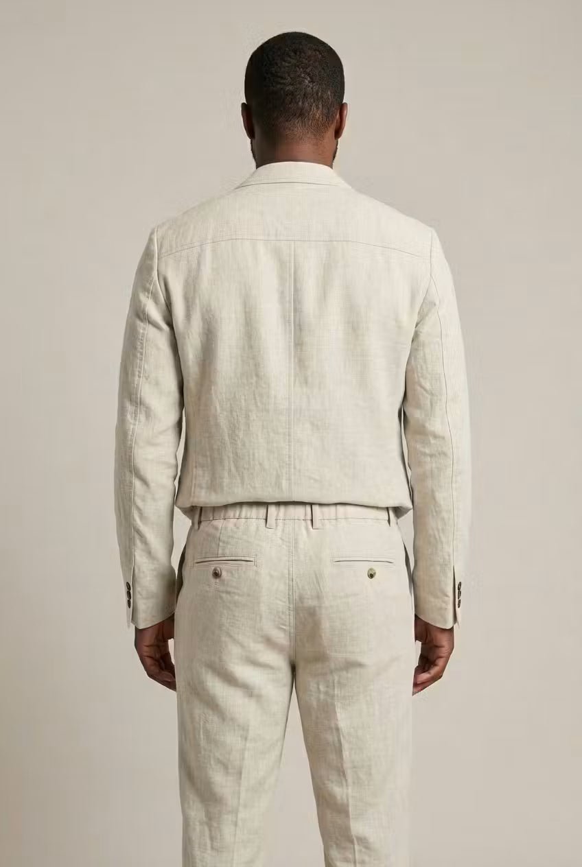 Man wearing a relaxed fit two-piece suit, showcasing effortless style for smart casual spring/summer events.