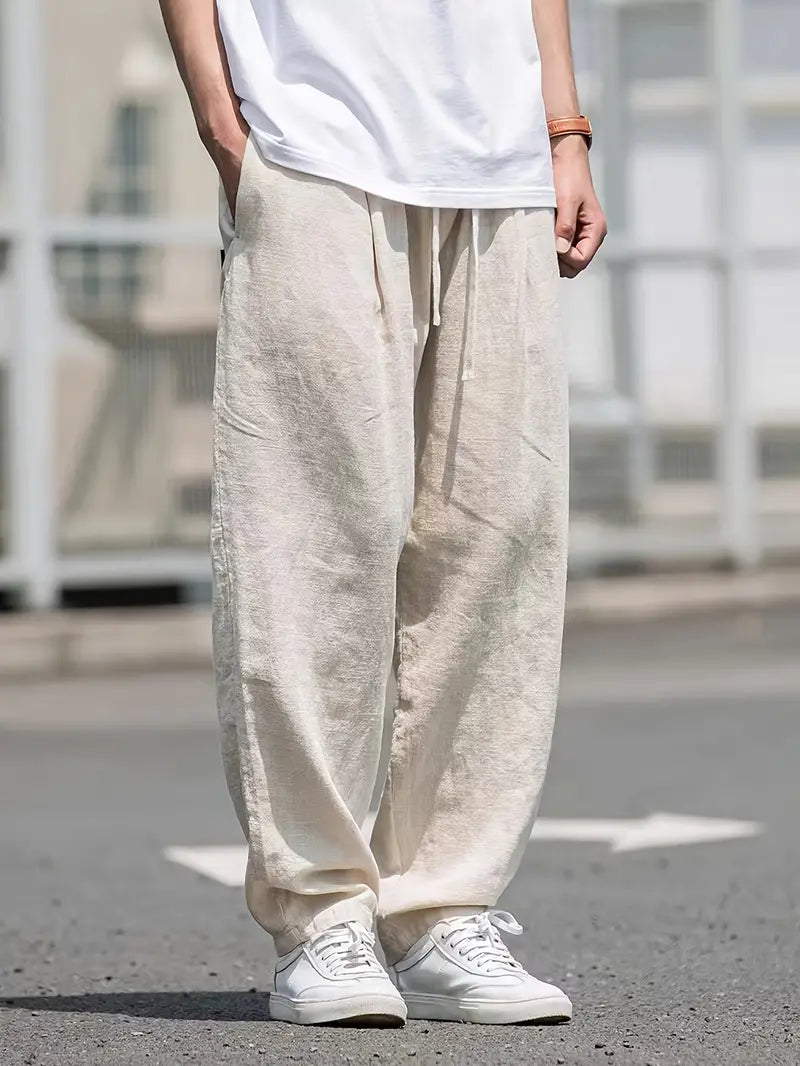 Men's relaxed fit wide leg trousers in khaki, perfect for comfortable warm weather and casual style.