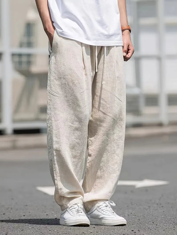 Men's relaxed fit wide leg trousers in khaki, perfect for comfortable warm weather and casual style.